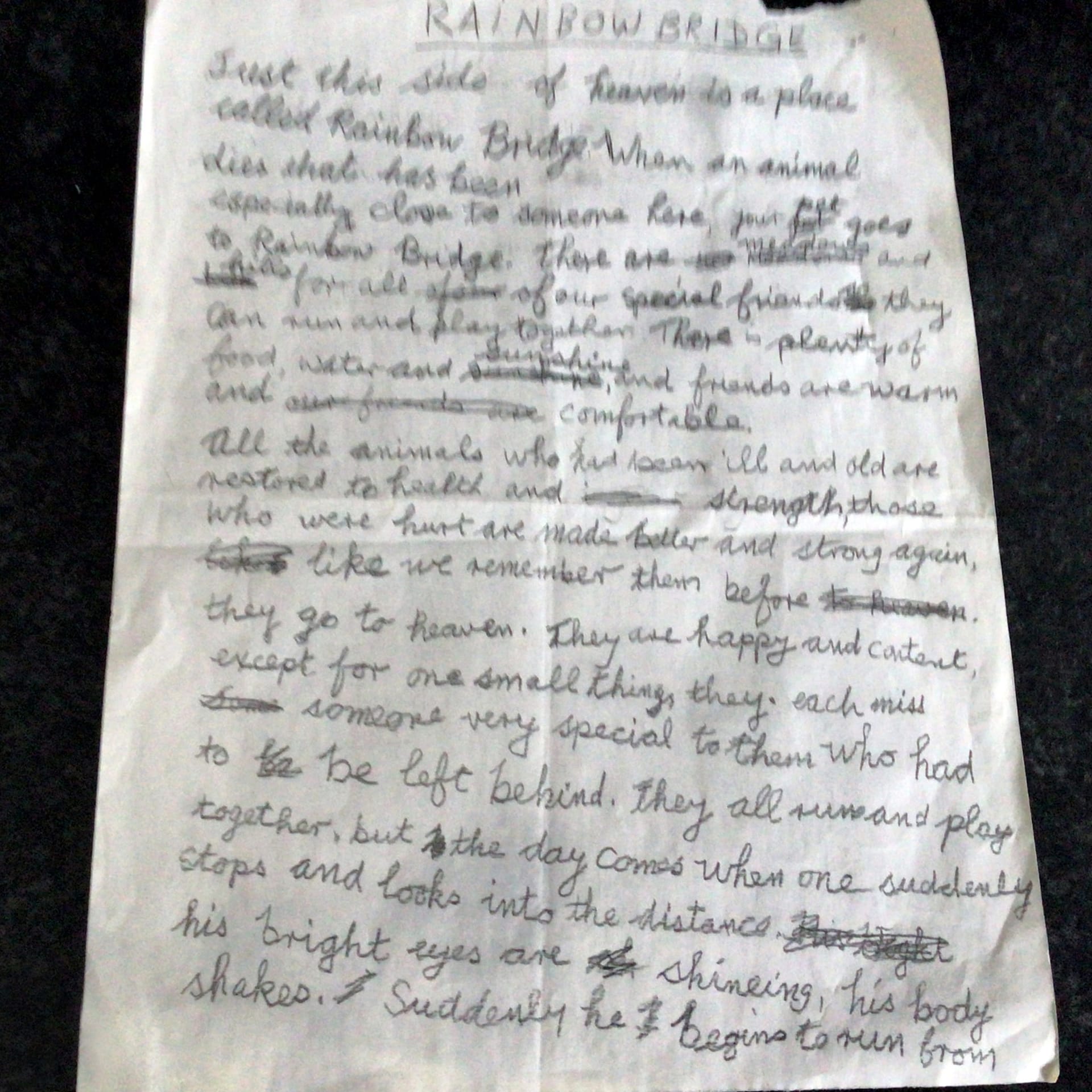 Front of Edna Clyne-Rekhy's handwritten Rainbow Bridge manuscript, headed Rainbow Bridge and written on lined notebook paper